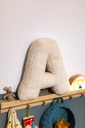 Boucle Letter cushion A by Bettys Home Teddy Letter Pillow on shelf in kids room as kids room decorations idea