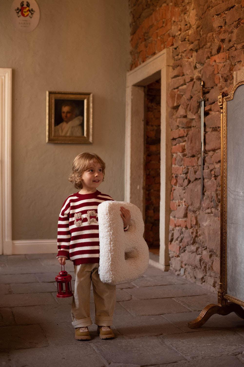 Boucle Letter cushion B by Bettys Home Teddy Letter Pillow held in hands by cute boy 
