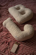 Boucle Letter cushion B and J by Bettys Home Teddy Letter Pillow in cream lying on bed 