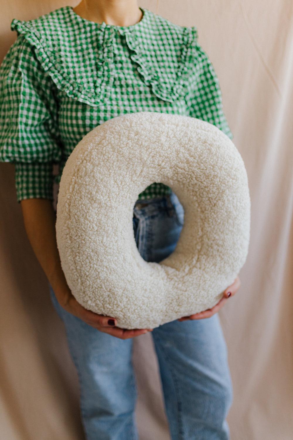 boucle letter cushion O teddy pillow by bettys home held by woman in green shirt xmas gift idea