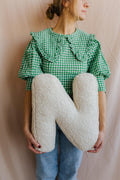 boucle letter cushion N teddy pillow by bettys home held by woman in green shirt kids gift idea