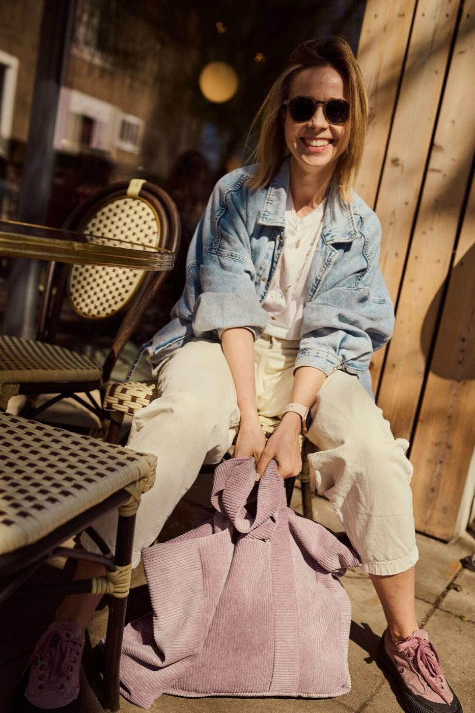 Corduroy Mom Bag in Lavender by Bettys Home.Young mom with her lavender tote bag siting in restaurant 