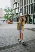 girl on skateboard with green gingham backpack. checkered backpack for kids  by bettys home